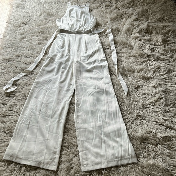 Mustard Seed Pants - 4/$24 NWT Mustard Seed off-white sleeveless jewel attached belt pleated jumpsuit